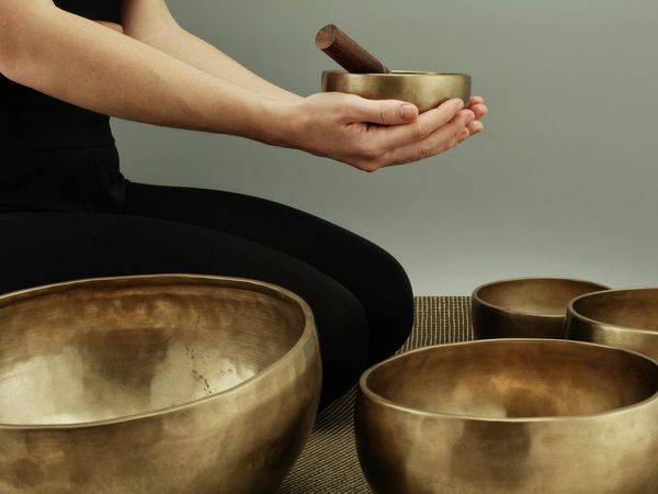 Close-up on a person's hands in a precise, controlled position.